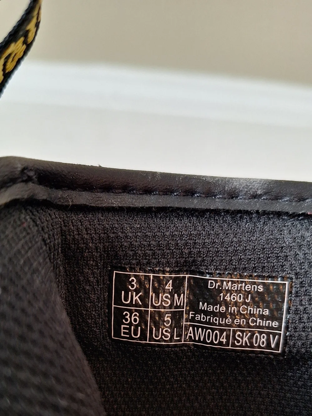 Dr. Martens Black Patent Lace-Up Kids Boots with Yellow Stitching